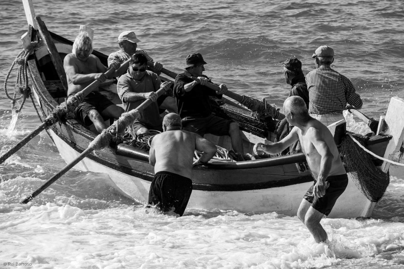 men boarding a fishers boat